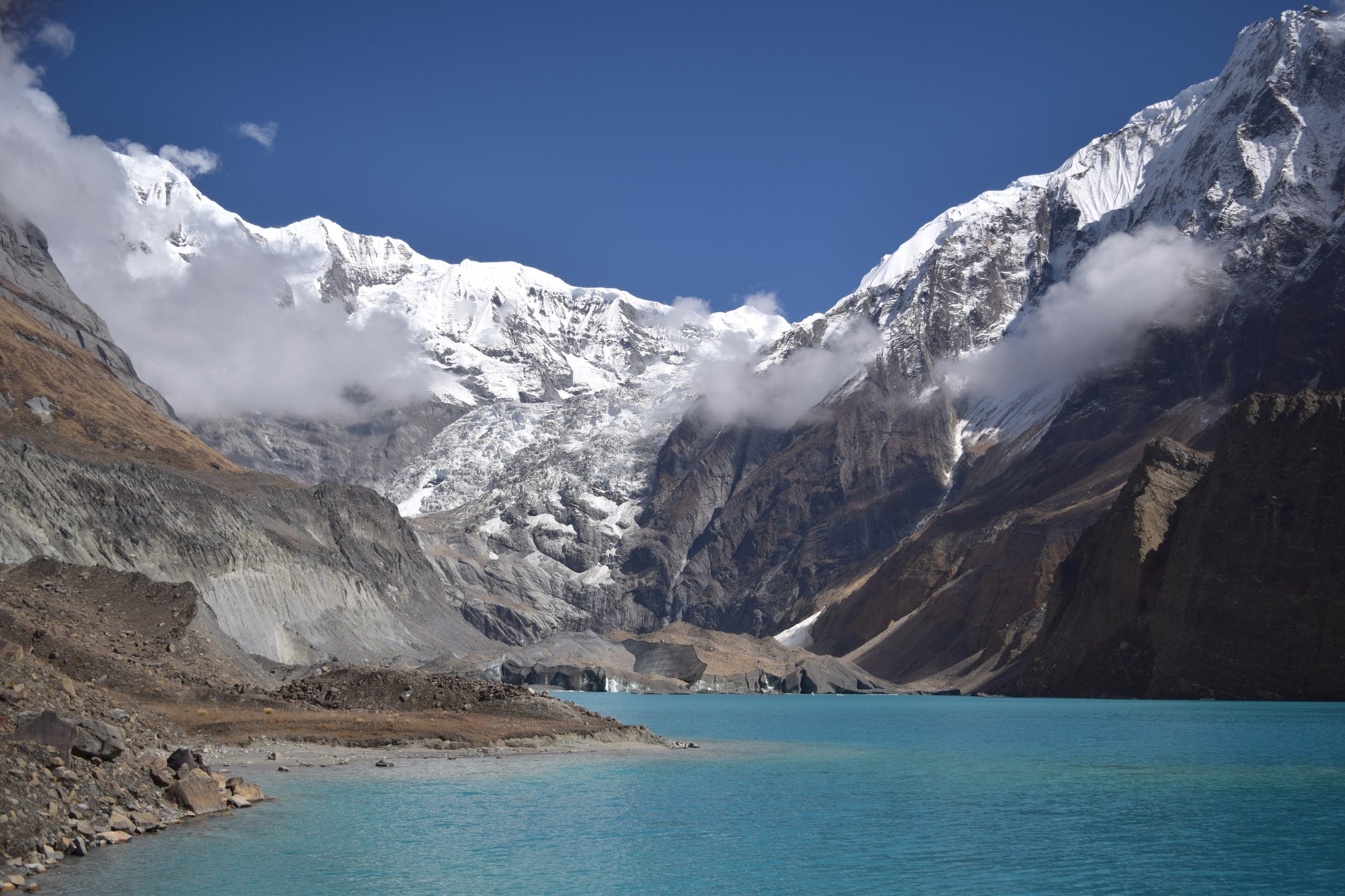 A glacial lake below snow-covered peaks in the Annapurna region